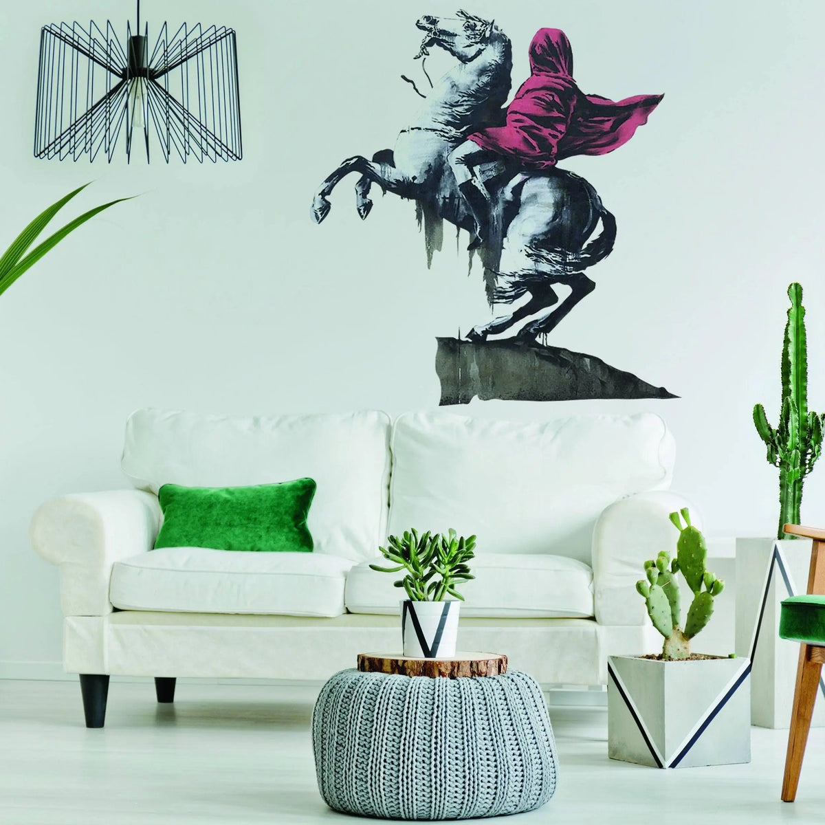 Napoleon vinyl wall art decal in modern living room with sofa and plants.