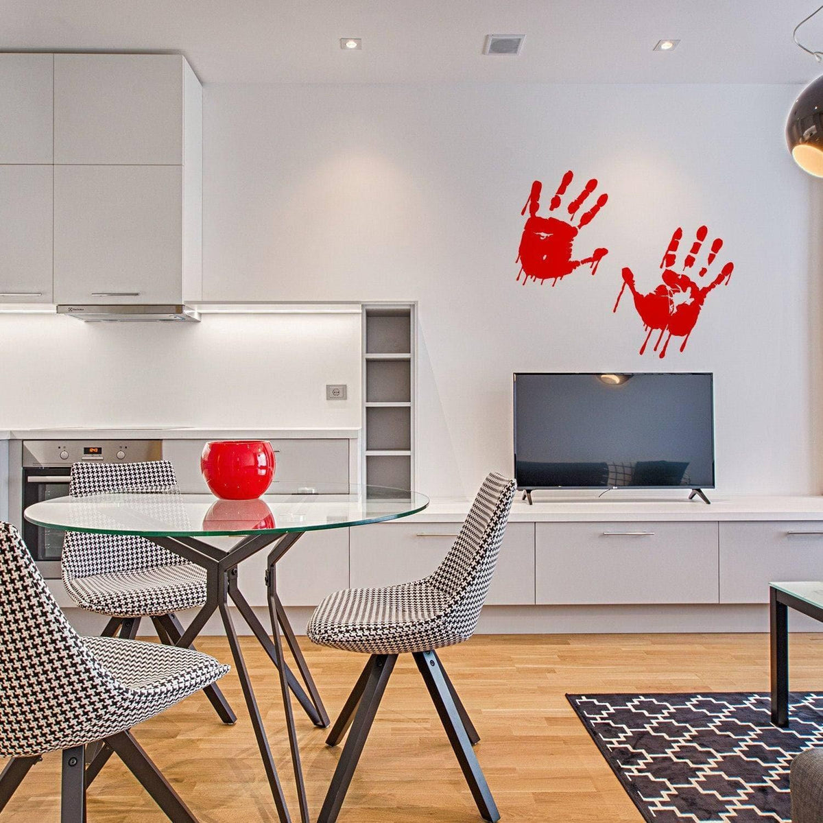 Spooky red handprint vinyl decals on a modern kitchen wall, adding a haunting touch to the decor.