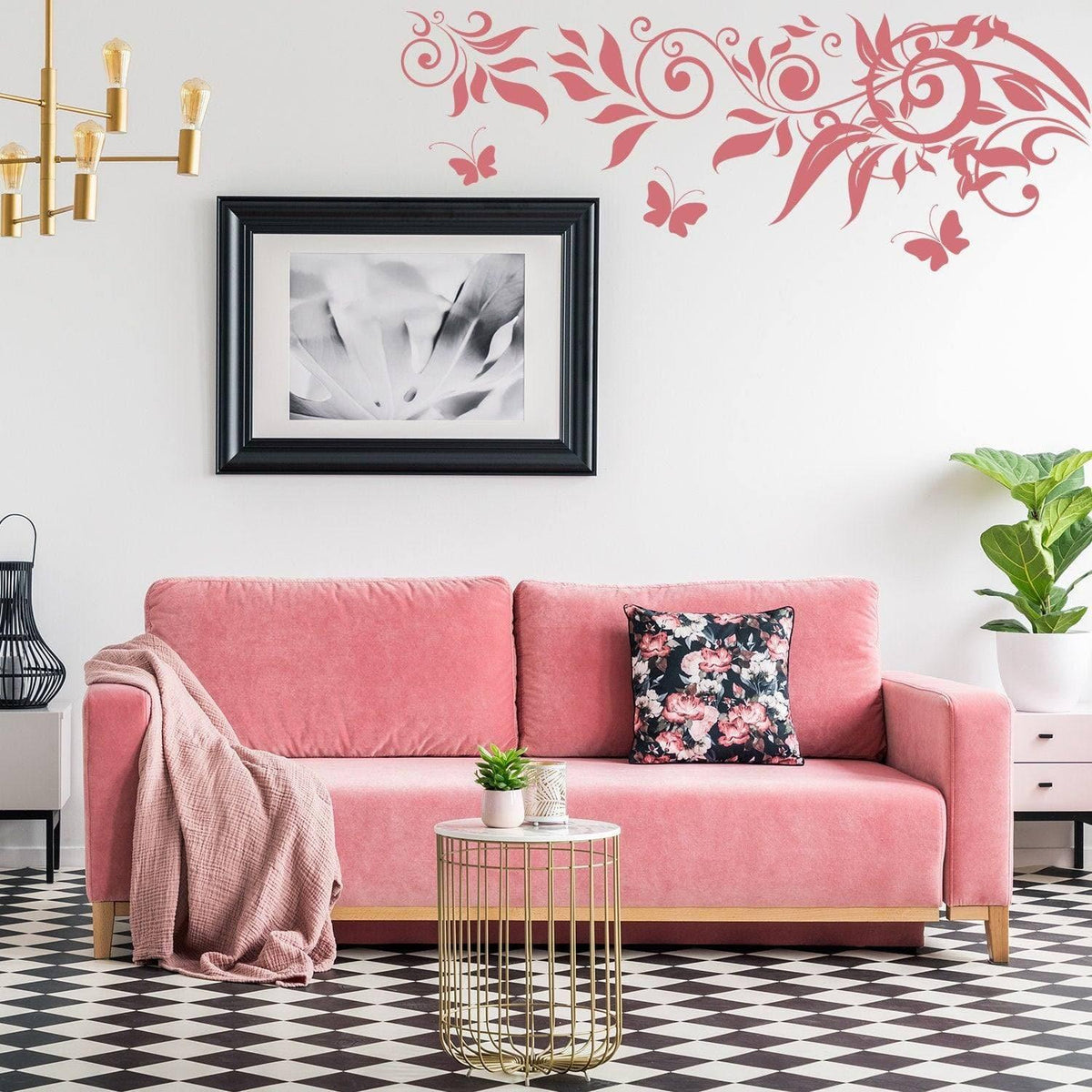 Whimsical butterfly wall art decal above a pink sofa in a stylish living room with modern decor.