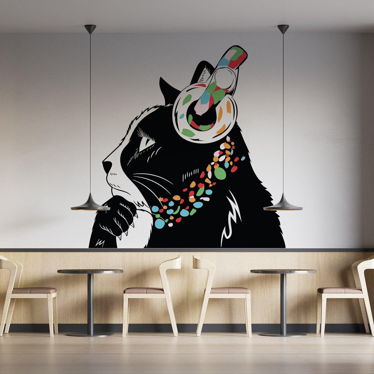 Charming cat wall decal with headphones in a modern cafe decor, adding whimsical touch to the space.