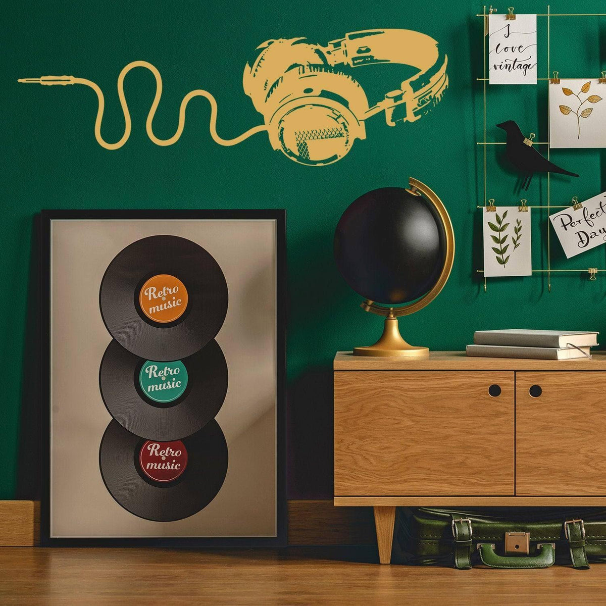 Decorative vinyl wall decal of headphones on a green wall, showcasing musical design for music lovers.