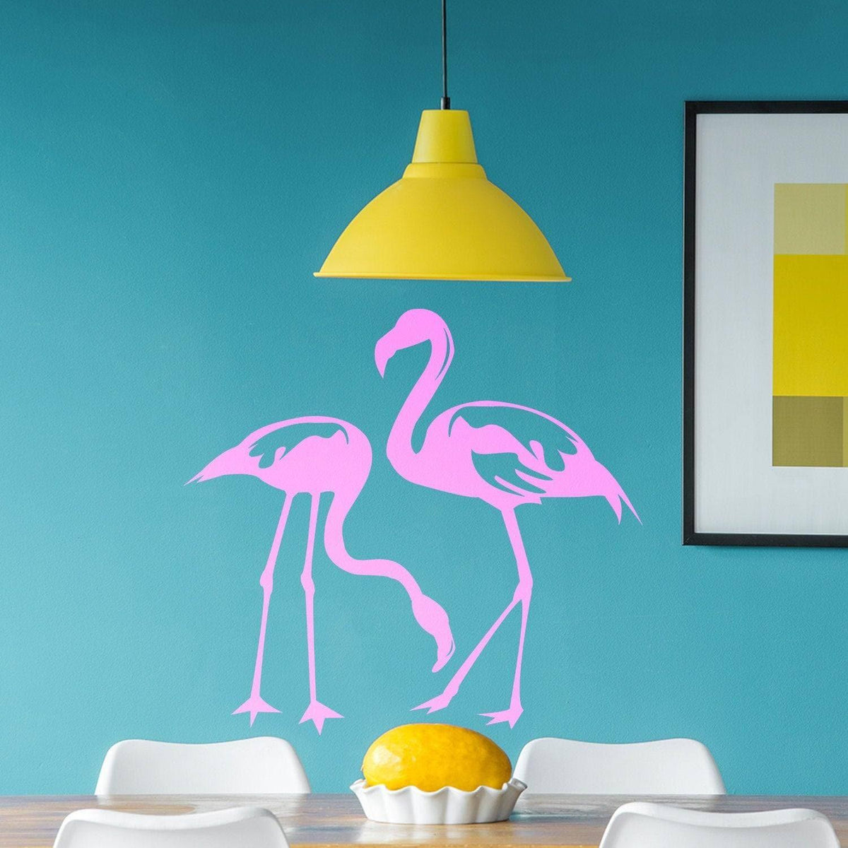 Flamingo wall decal featuring two pink flamingos on a blue wall, adding tropical charm to home decor.