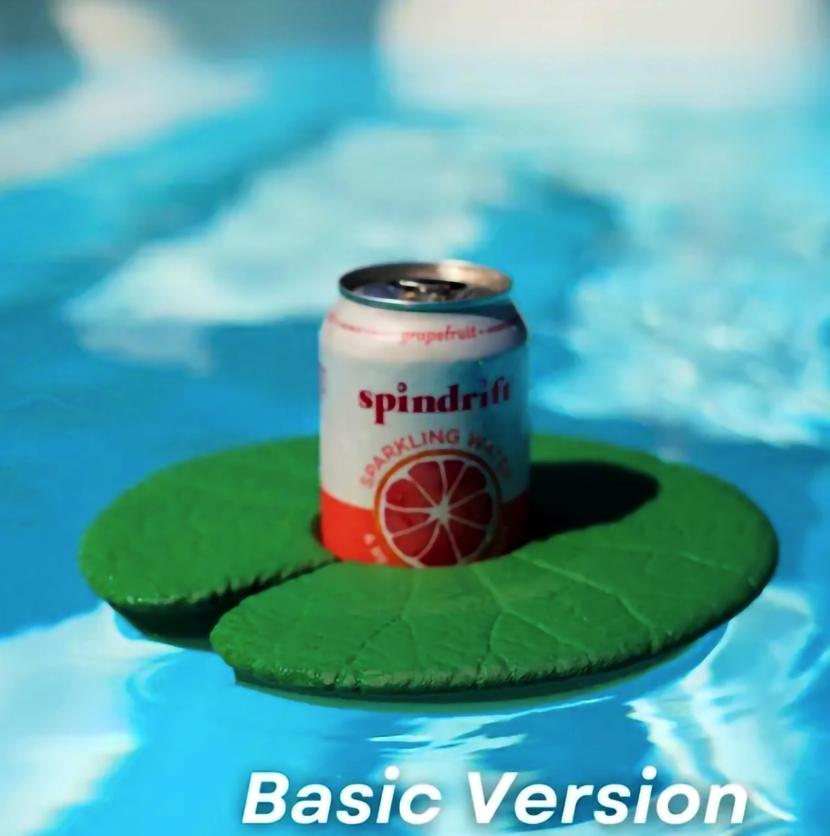 Lily Pad water cupholder floating in pool with a can of Spindrift sparkling water on top.