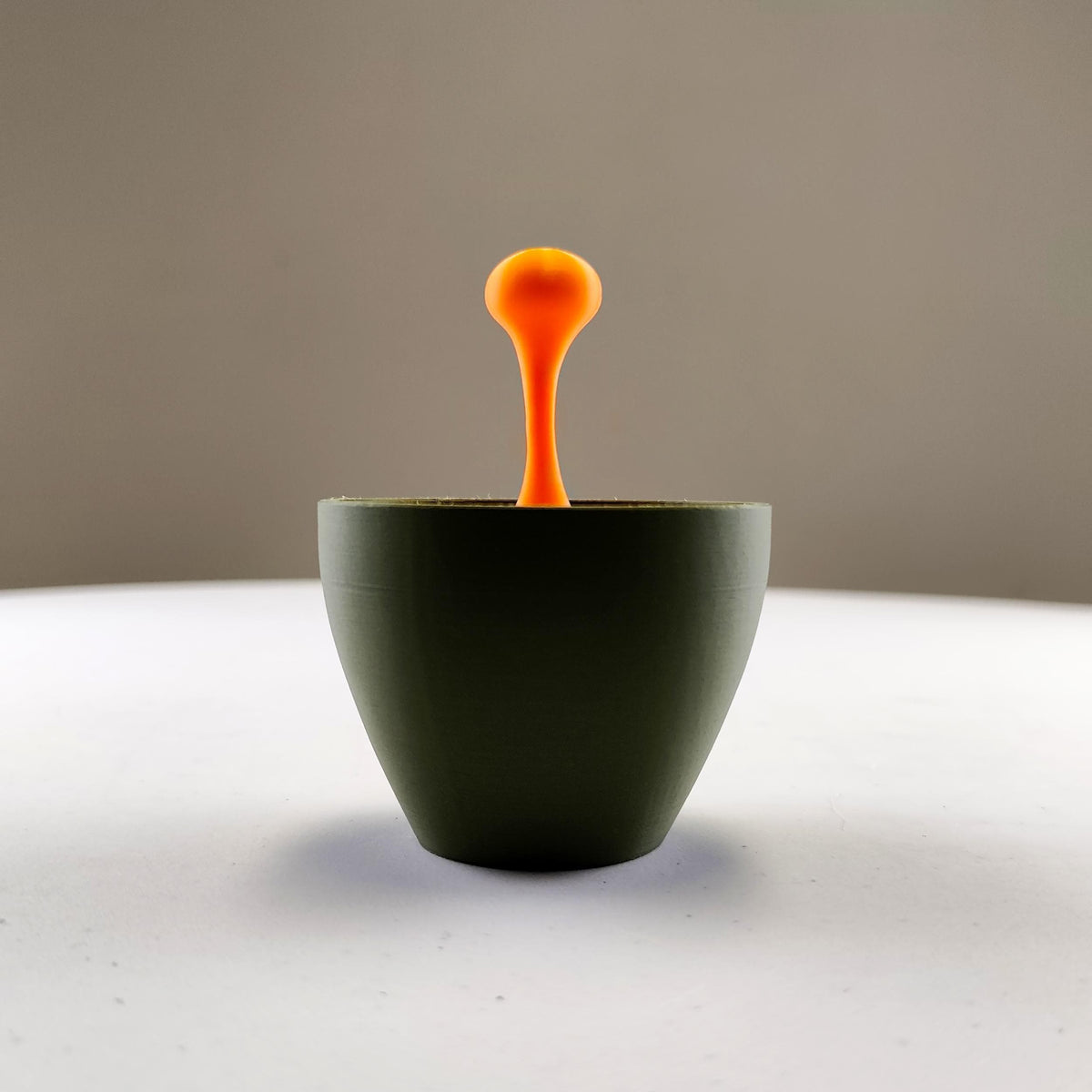 Floating Espresso Sculpture featuring suspended macchiato drop above a small cup