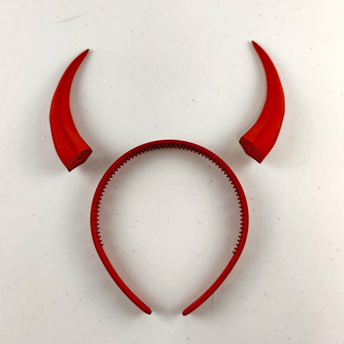 Tall curved demon horns headband with two tall textured horns with an upward curved fantasy silhouette