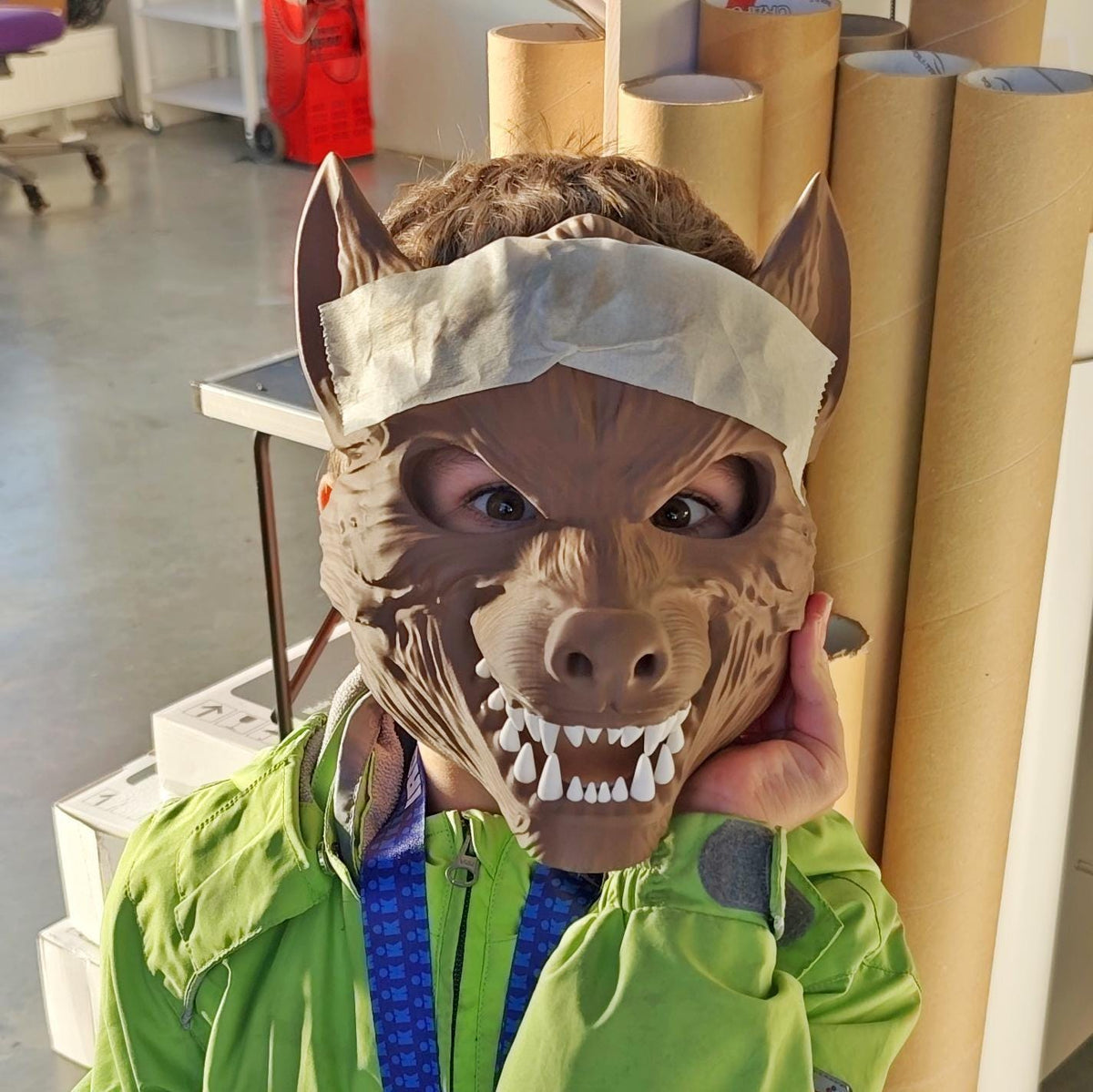 Werewolf Cosplay Mask featuring sharp teeth and pointed ears, posing outdoors in a dark outfit