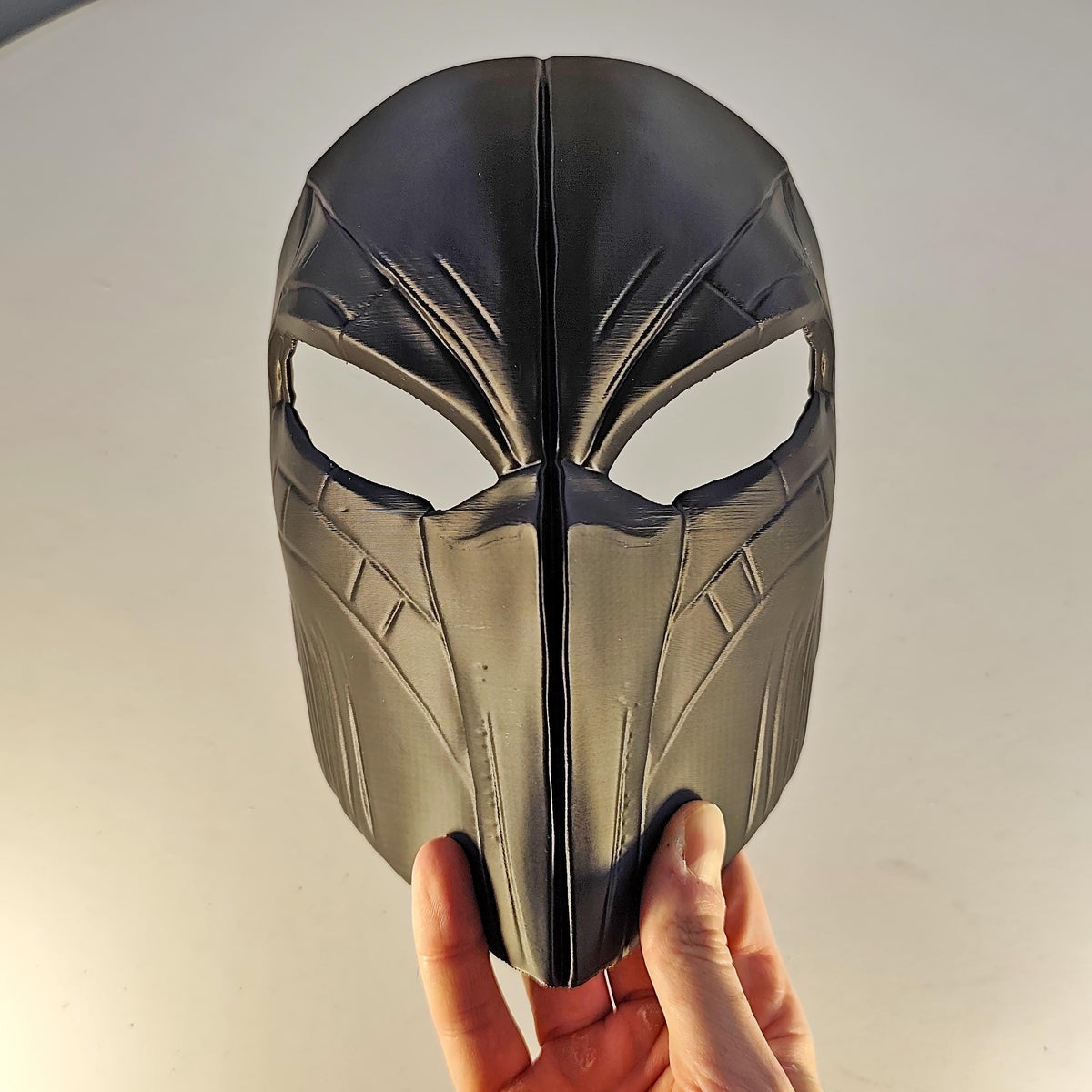 3D printed futuristic warrior mask with angular cheek panels and narrow eye openings
