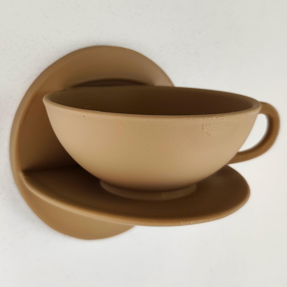Teacup Wall Shelf featuring teacup inspired form integrated into a floating ledge