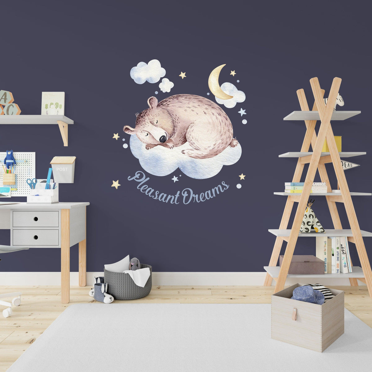 Adorable infant wall decal featuring a sleeping bear on a cloud with text 'Pleasant Dreams' for kids' room decoration.
