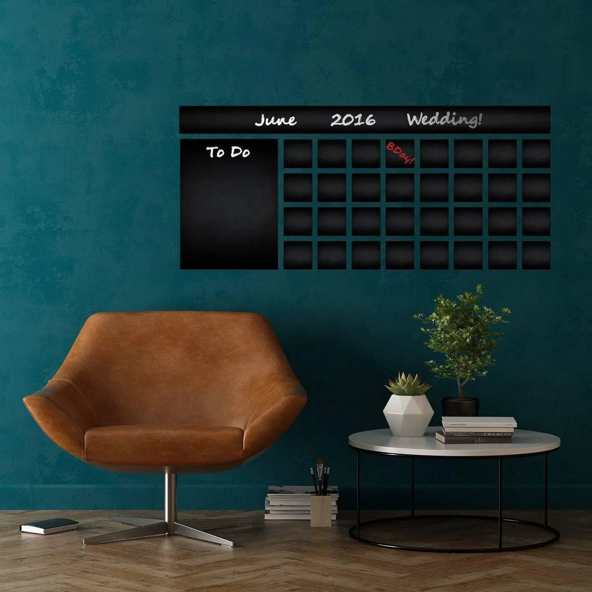 Large adhesive chalkboard wall decal displaying a monthly calendar in a stylish home setting.