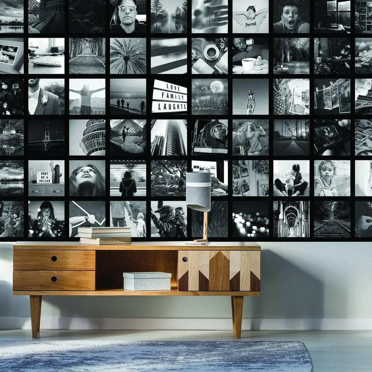 Custom memory wall art collage featuring black and white photos, showcasing cherished memories in a stylish living room.