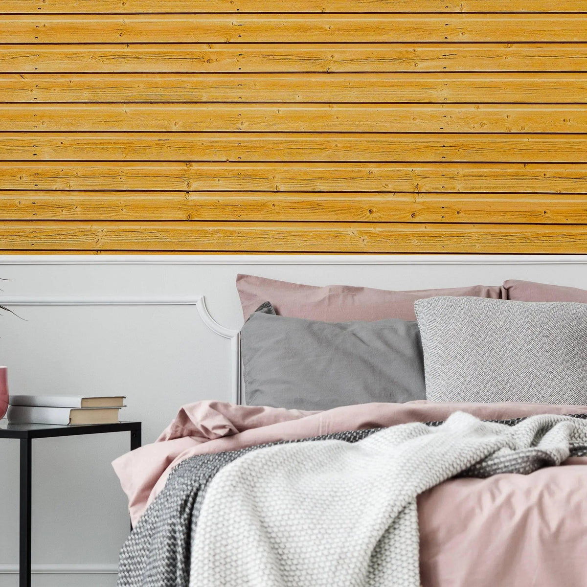 Rustic wood plank peel and stick wallpaper in a cozy bedroom setting with soft bedding and decor.