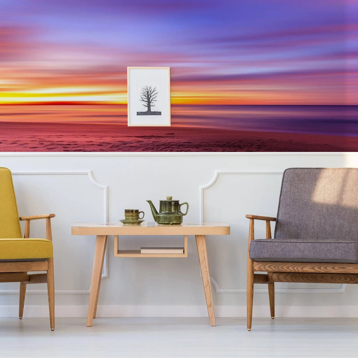 Sunset wall decals creating a serene atmosphere in a modern living room with stylish chairs and a coffee table.