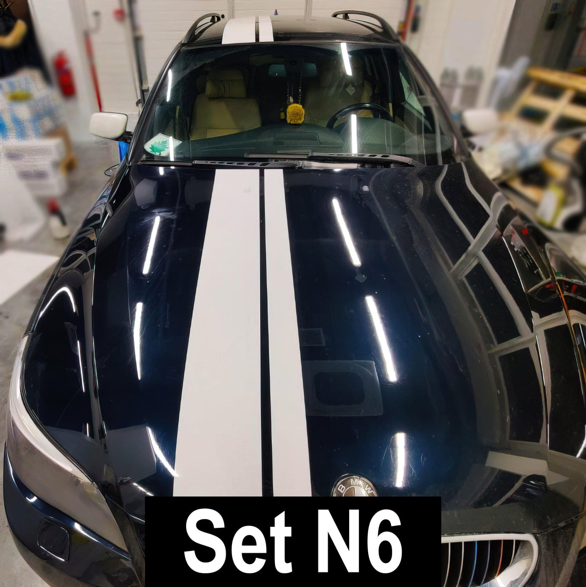 Stylish Two Lines Racing Stripes Car Decal on a dark blue vehicle, showcasing a sleek and modern design.