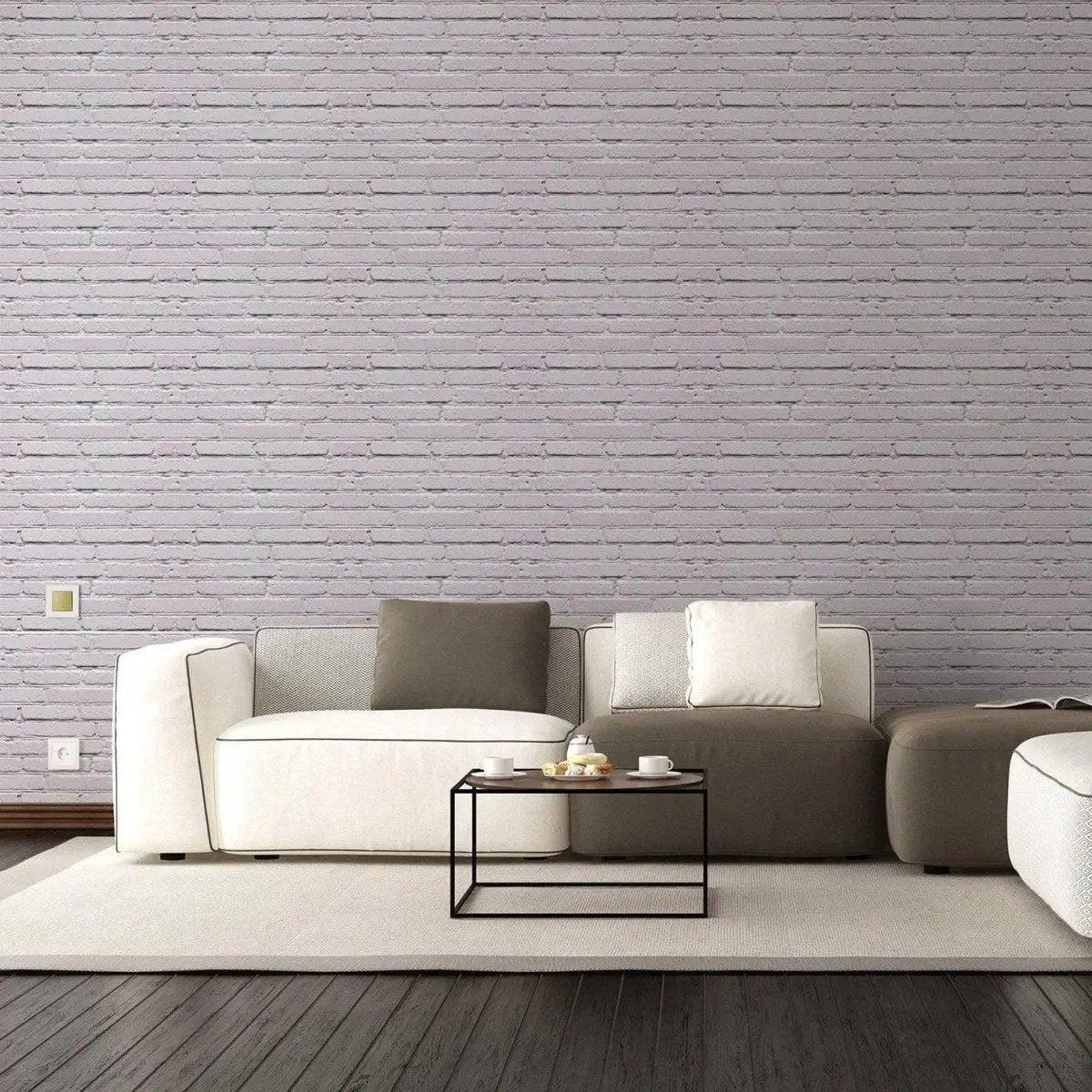 Modern living room featuring peel and stick 3D brick wallpaper, cozy white couch, and stylish coffee table.