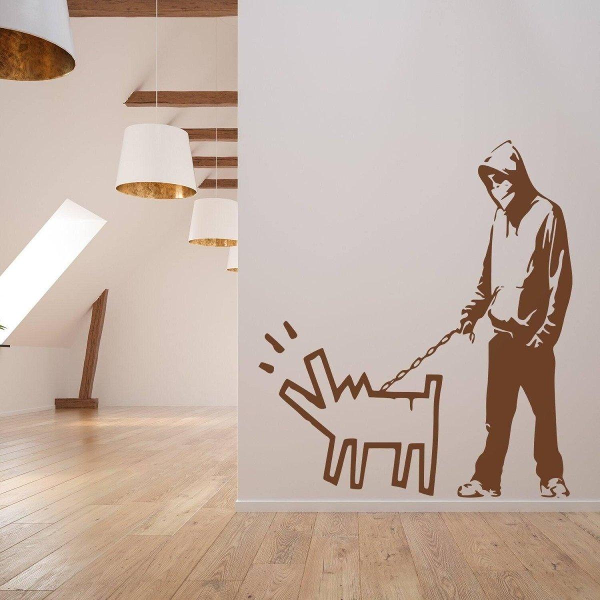 Banksy wall art decal featuring a hooded figure walking a dog.