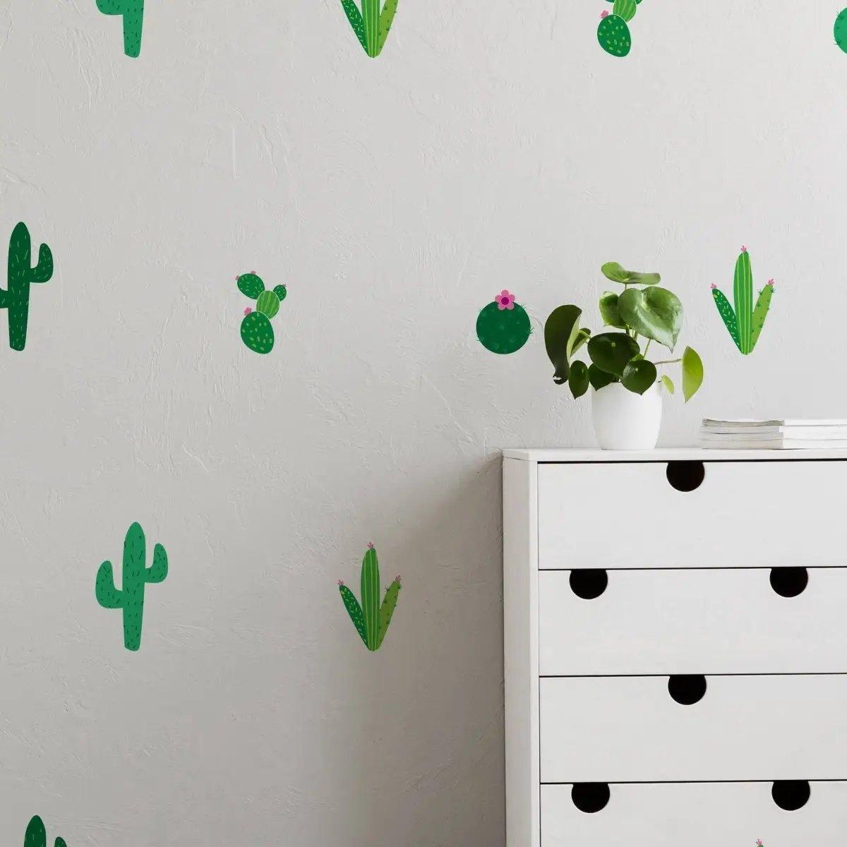 Cactus Oasis Vinyl Wall Decals on a textured wall beside a white drawer unit with indoor plants.