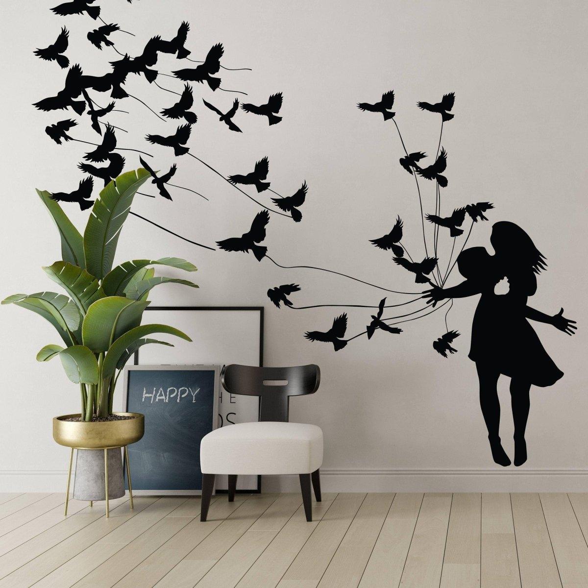 Artistic wall sticker of a girl surrounded by flying birds.