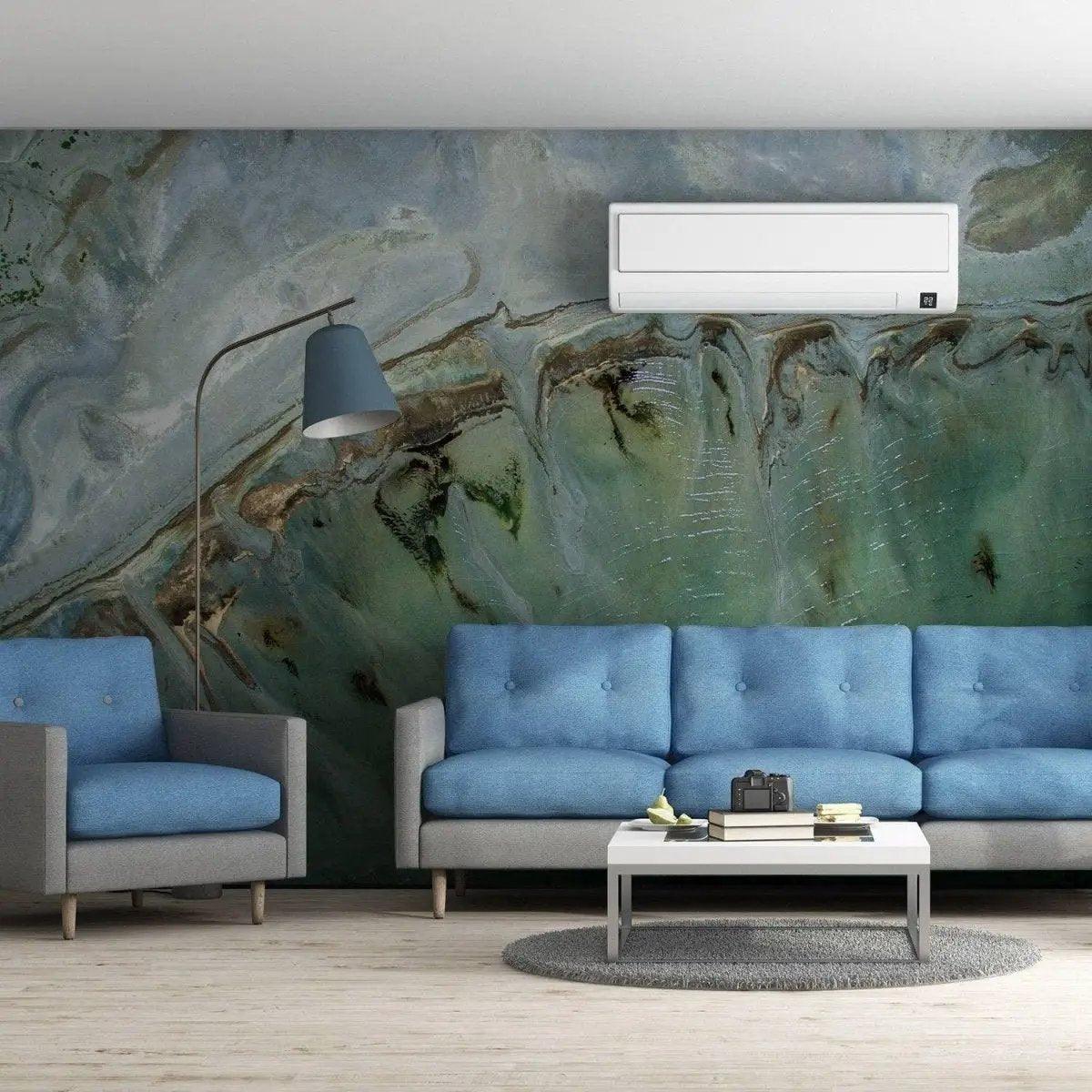 Chic marble design removable wallpaper in modern living room with blue sofas and stylish decor.