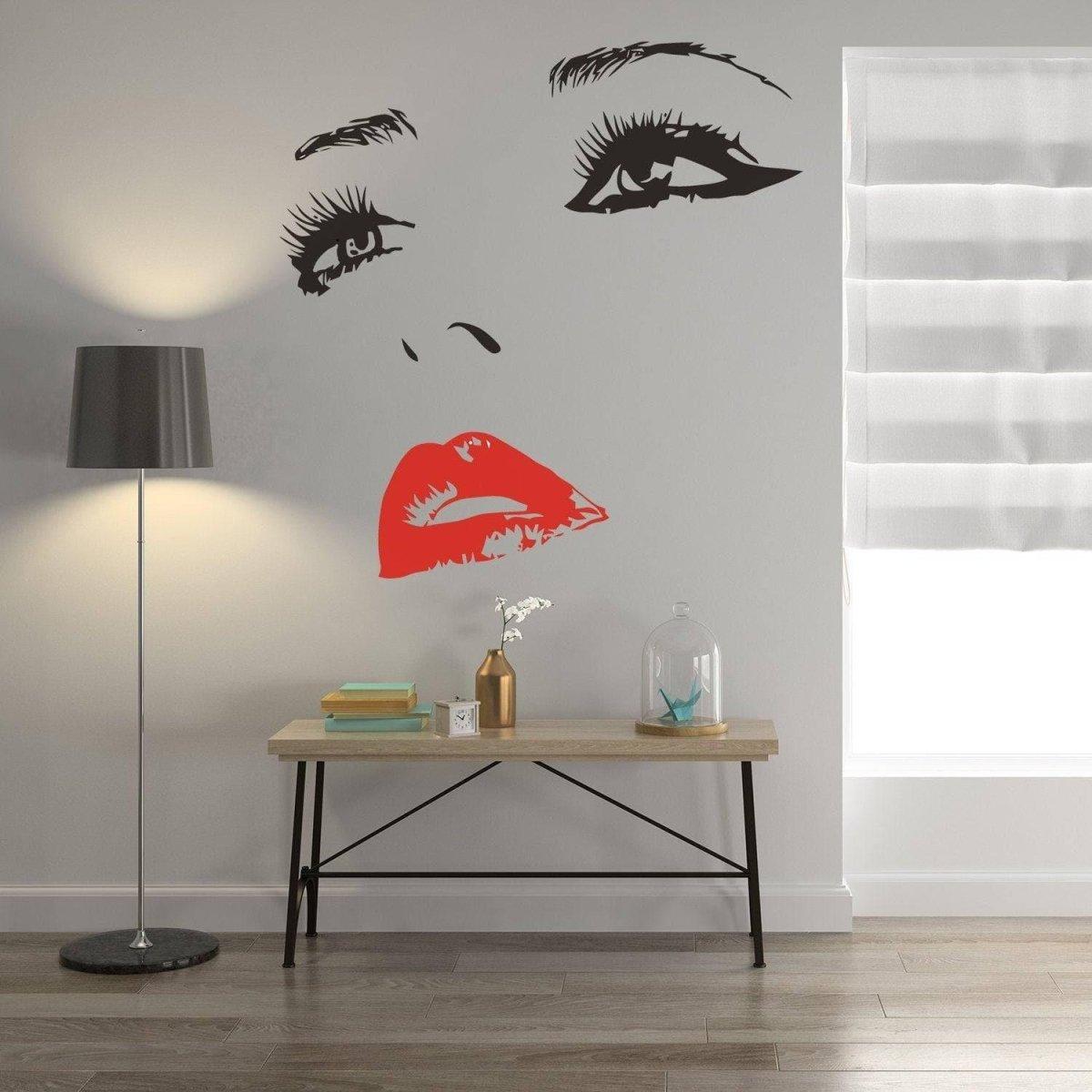 Charming black and red wall art decal of a woman's face, enhancing modern decor in a stylish interior.