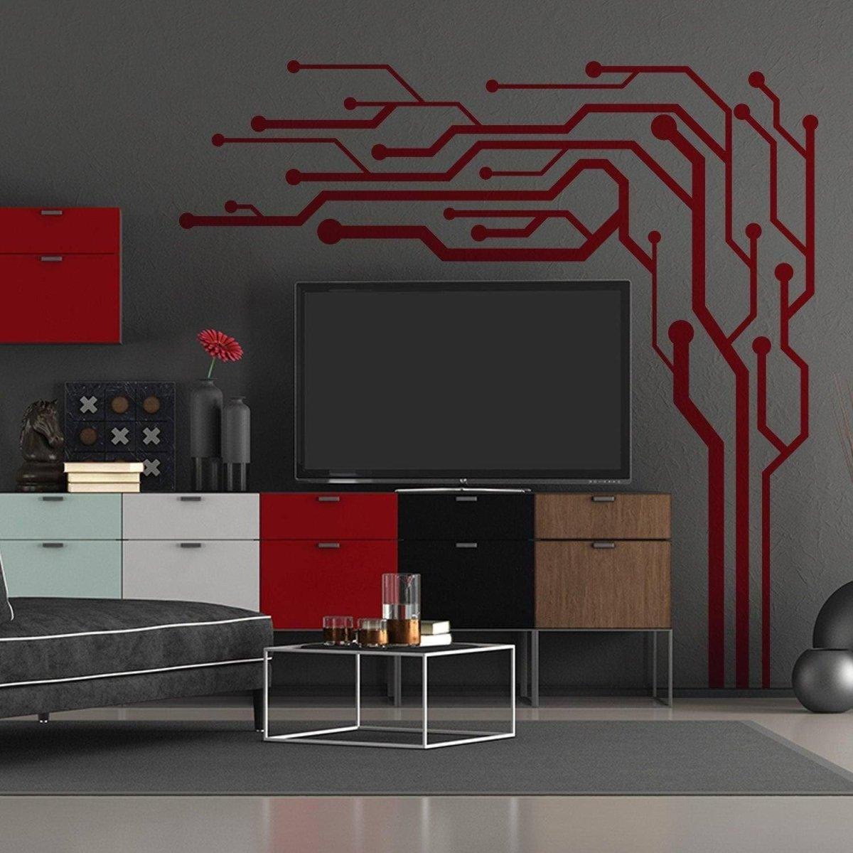 Stylish red circuit pattern wall decal above a modern TV unit, elevating living space decor with vibrant design.