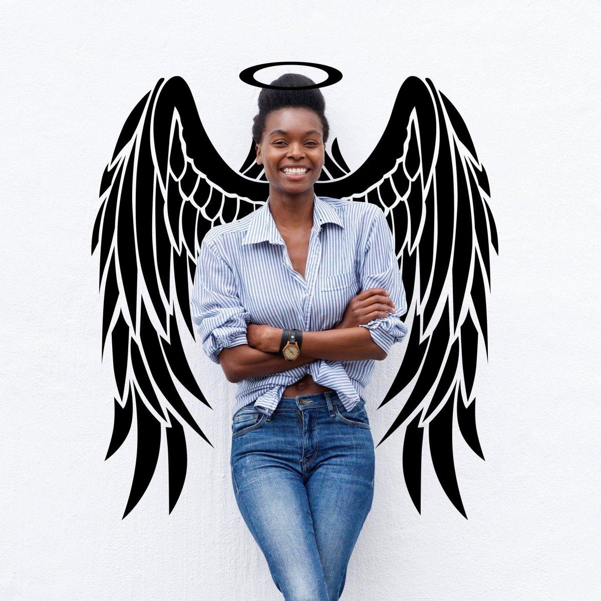 Smiling woman with angel wings wall sticker, showcasing the Majestic Feather Wall Sticker for magical home decor.