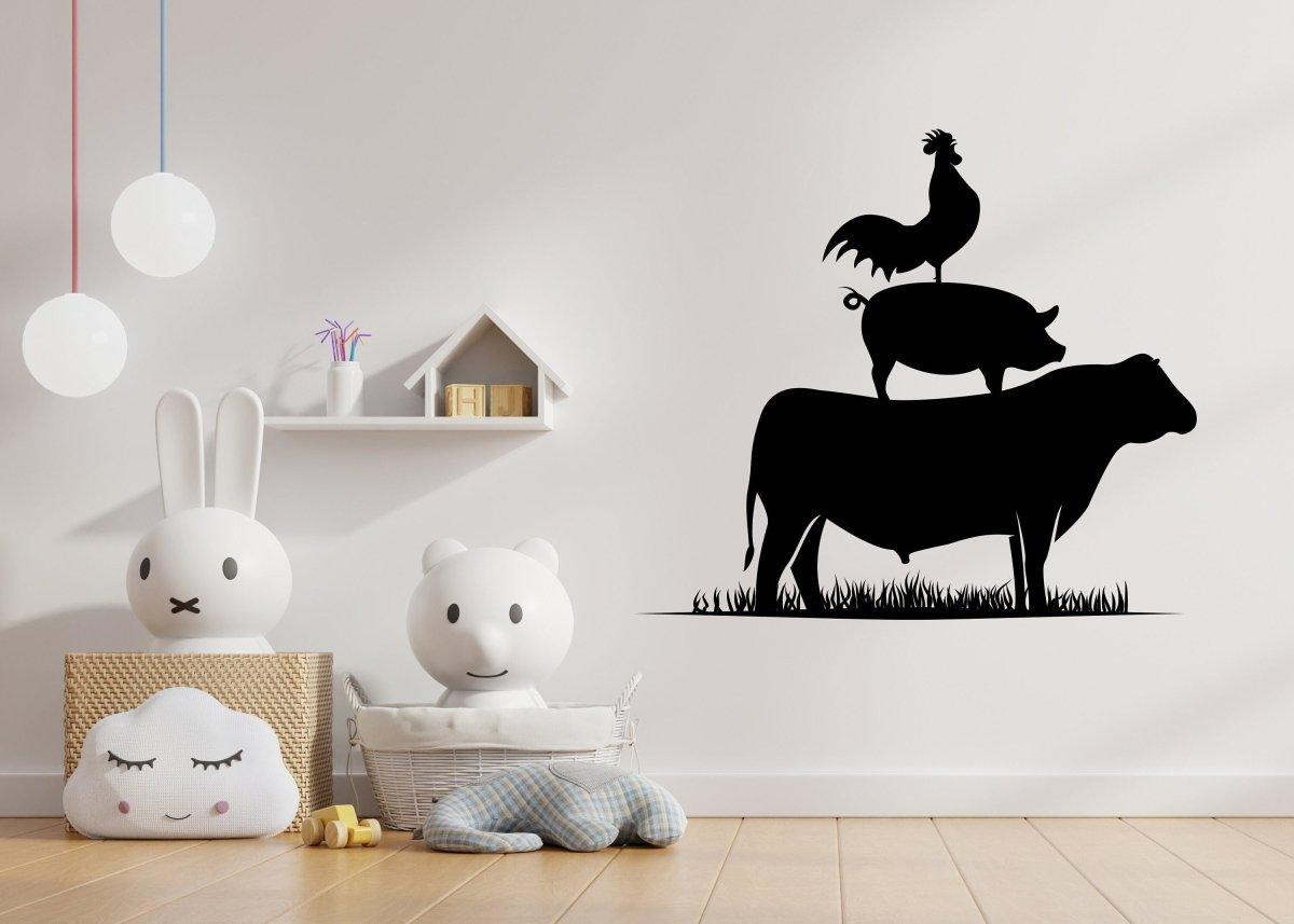 Charming wall art decal featuring a cow, pig, and rooster in a playful stacked arrangement for a farm-themed room.