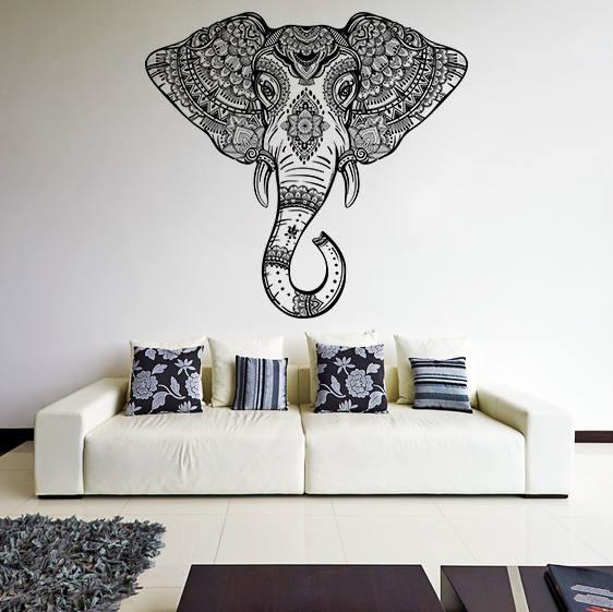 Detailed elephant head wall vinyl sticker above a white sofa, adding Aztec geometric decor to the room.