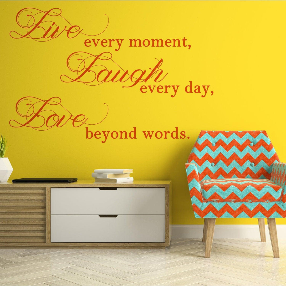 Live Laugh Love wall art on a yellow wall with colorful chair and modern furniture.