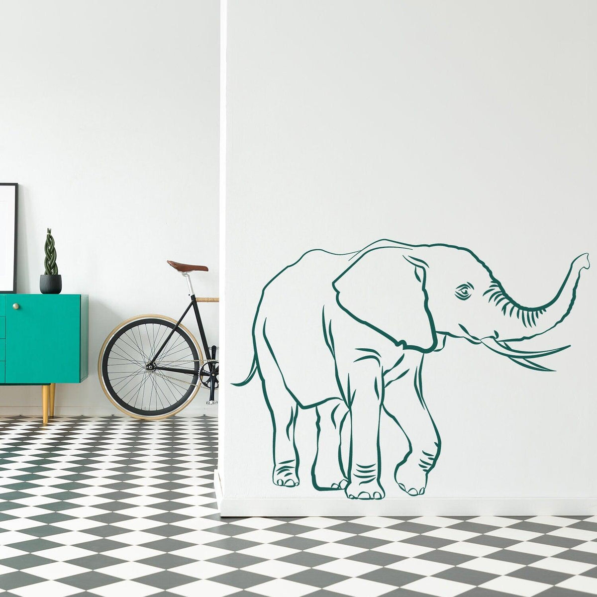 Cute elephant vinyl wall decal on a stylish interior wall, adding whimsy to the room decor.