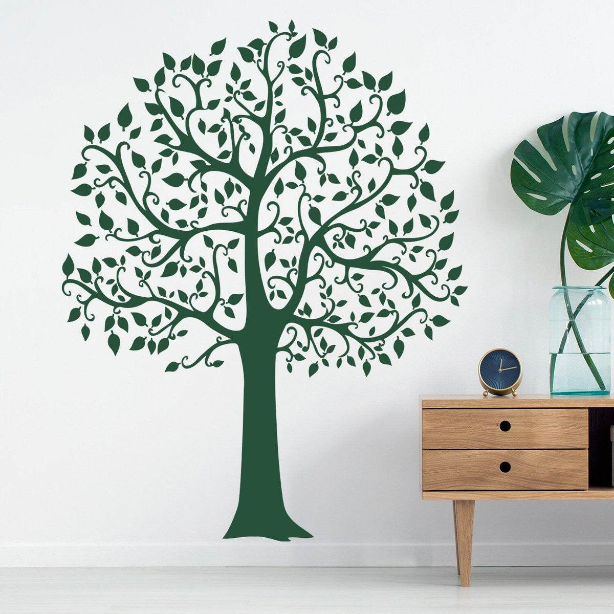 Green tree wall decal with detailed branches and leaves, enhancing room decor and adding a natural touch.