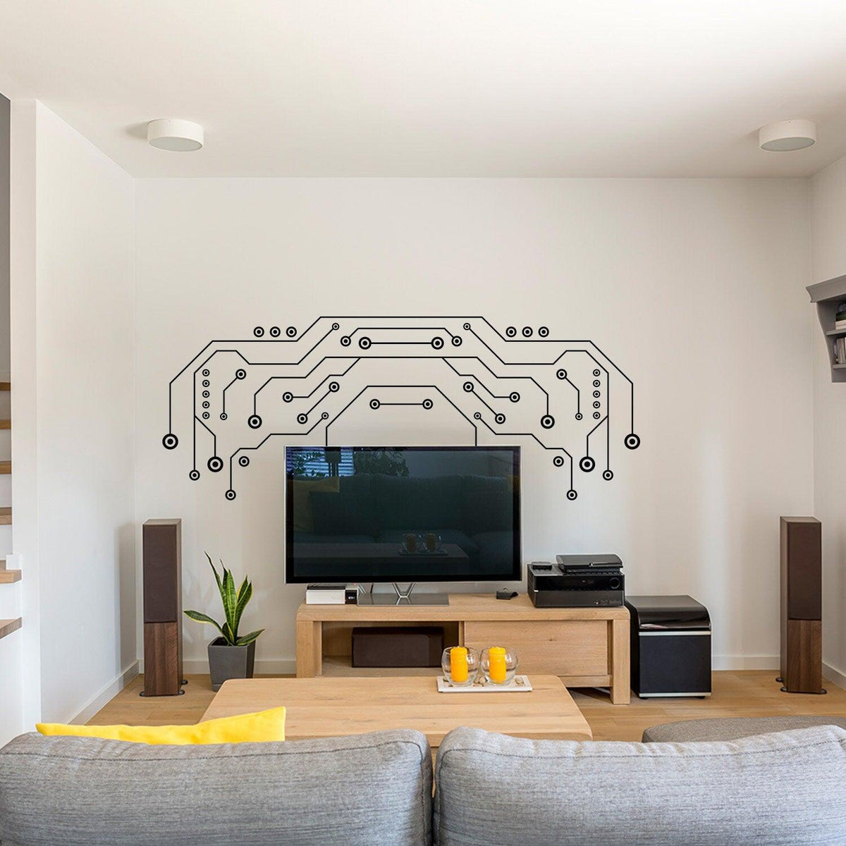 Modern TV wall decor featuring vinyl circuit board decals above a sleek television in a stylish living room.