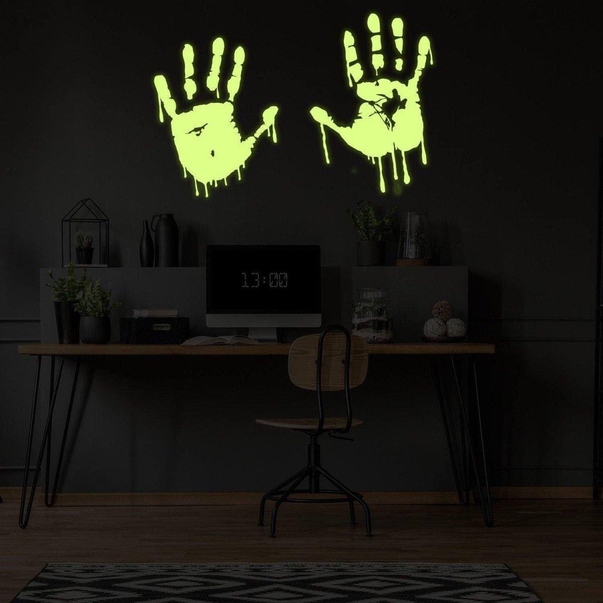Glowing zombie blood wall decal featuring luminous bloody hands in a dark room.
