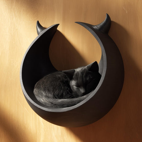 Black crescent moon 3D printed wall cat bed with a grey cat