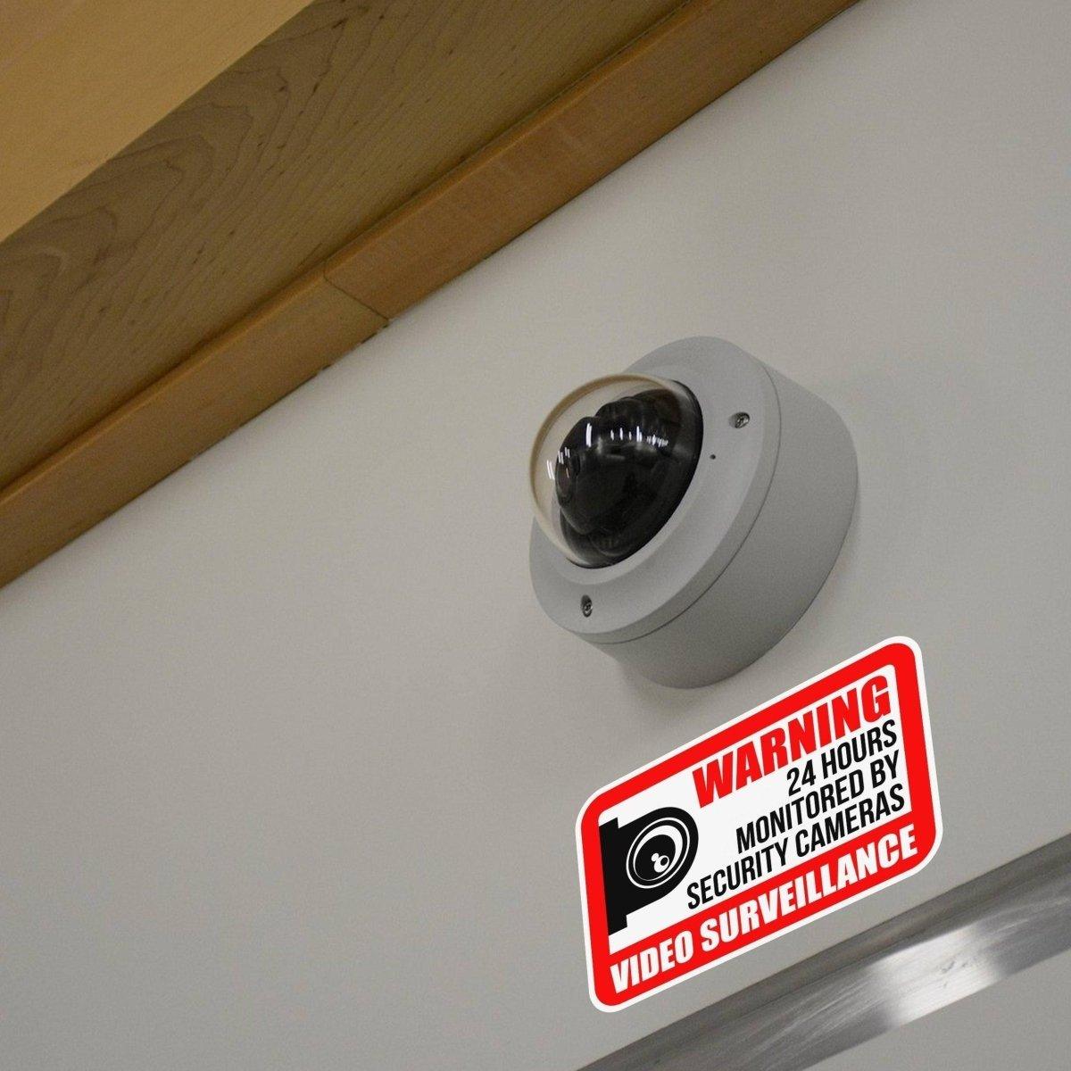 Video surveillance sign shown beside a security camera.