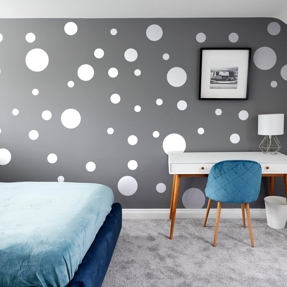 Stylish bedroom featuring adhesive white round dot stickers on gray wall, showcasing creative decor ideas.