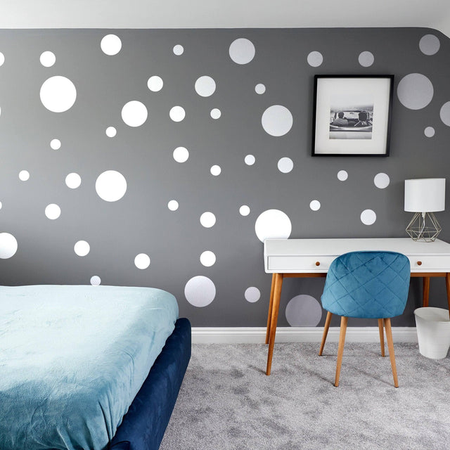Stylish bedroom featuring adhesive white round dot stickers on gray wall, showcasing creative decor ideas.