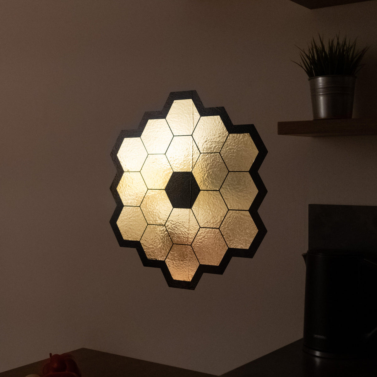 James Webb Space Telescope mirror wall sticker in gold chrome vinyl.