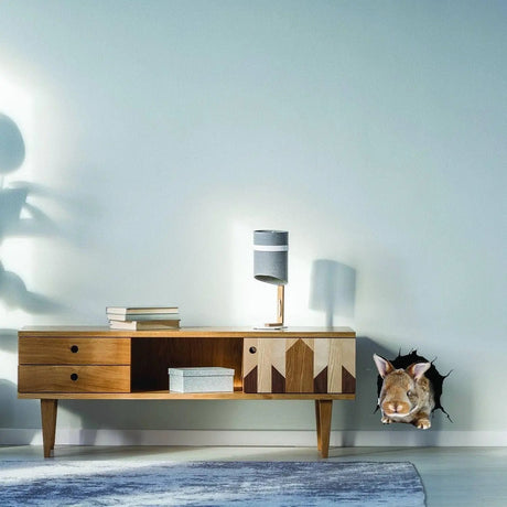 Rabbit wall decal peeking through a printed wall opening