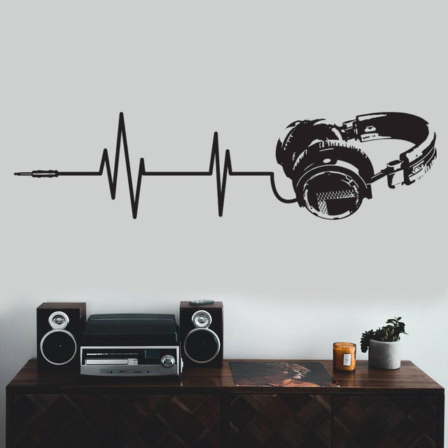 Adhesive music notes wall decal featuring headphones and soundwave design.