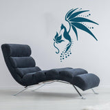 Stylish hummingbird wall decal above a modern black lounge chair in a contemporary living space.