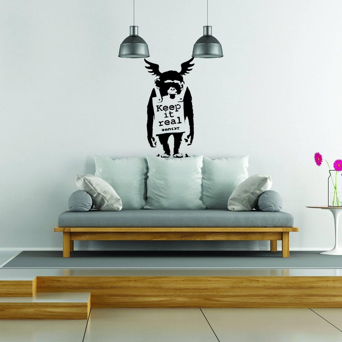Monkey graffiti wall sticker with Keep It Real text displayed on a modern wall.