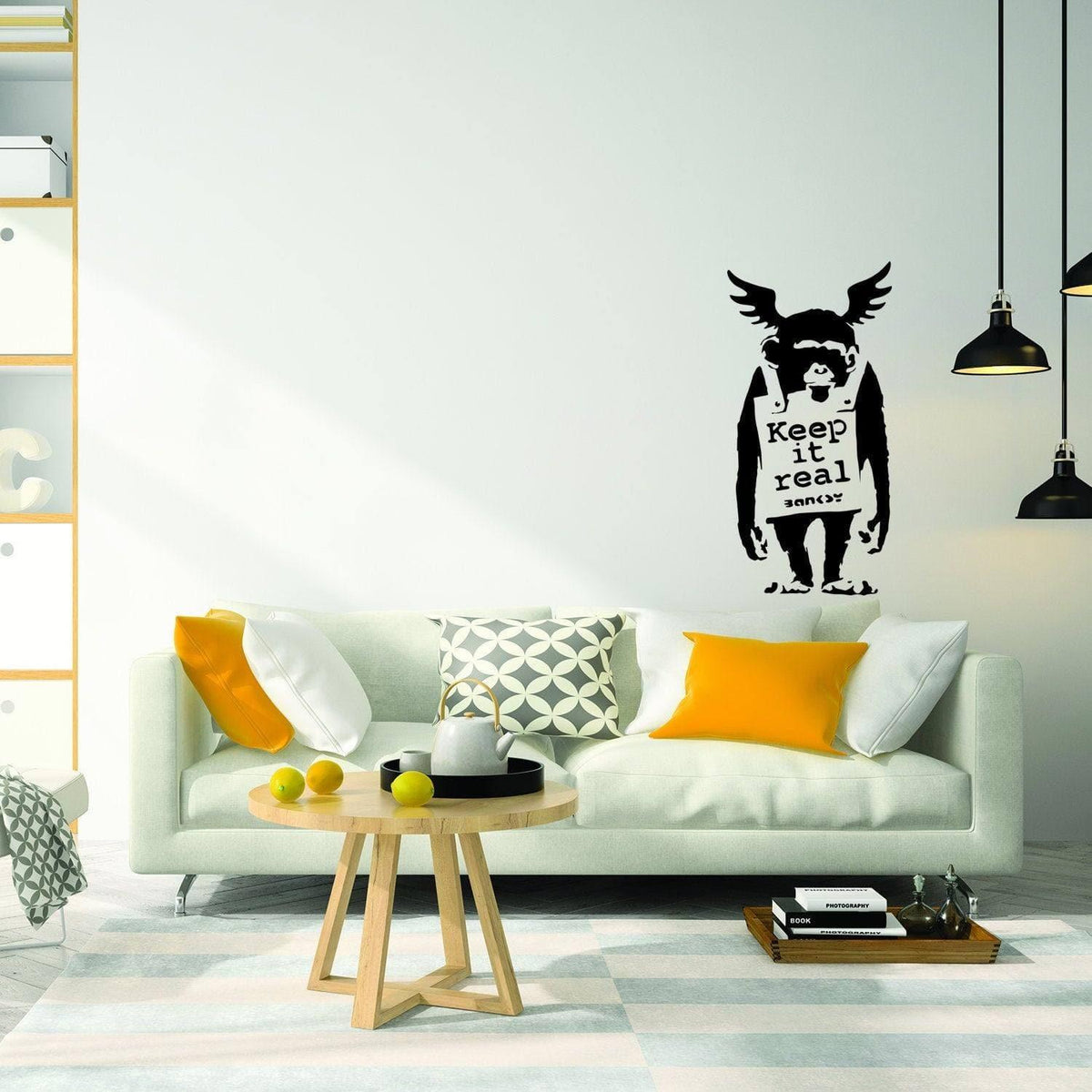 Winged monkey wall sticker with Keep It Real text in modern room decor.