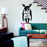 Monkey graffiti wall decal with Keep It Real text displayed in a living room.