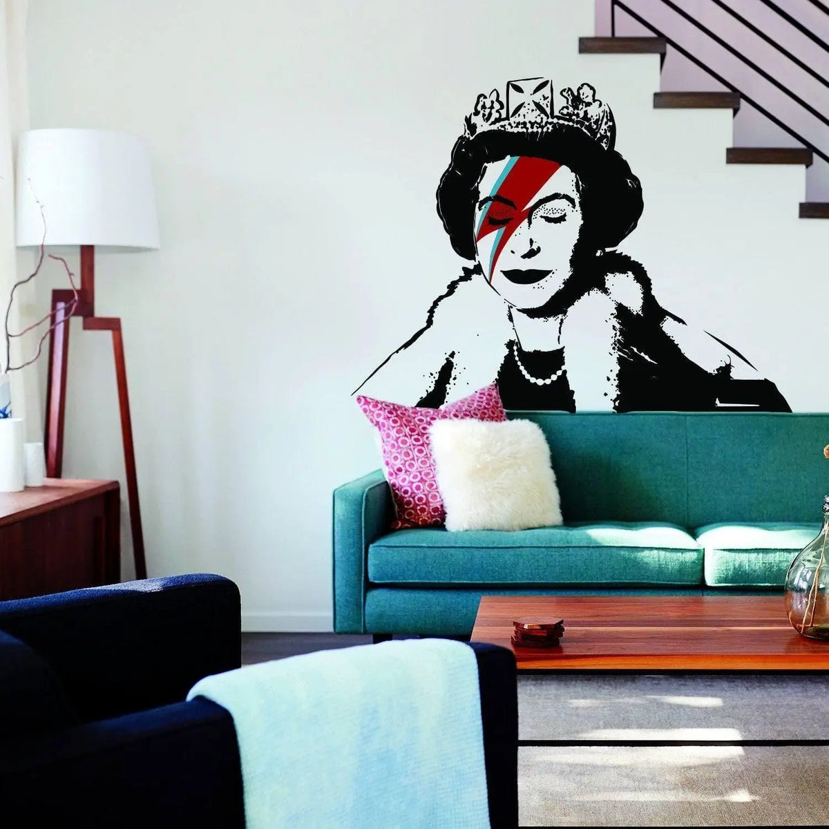 Regal vinyl sticker of a crowned figure with striking colors on a living room wall, adding artistic flair to the space.