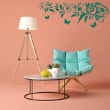 Vinyl Whimsy Wings sticker wall art above cozy chair and lamp in stylish kid's room decoration.