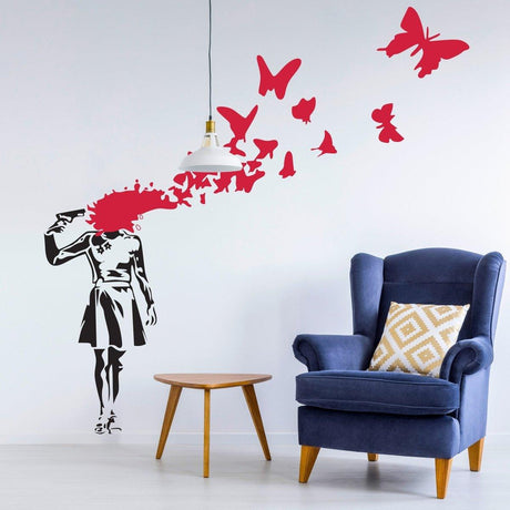Emotional Butterfly Girl wall decal in black and red against a modern living room backdrop with a blue chair.