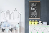Nursery featuring a chalkboard wall with the phrase 'Dream big little one' and stylish decor elements.