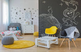 Colorful children's room with chalkboard wall decal, cozy decor, and playful furniture.
