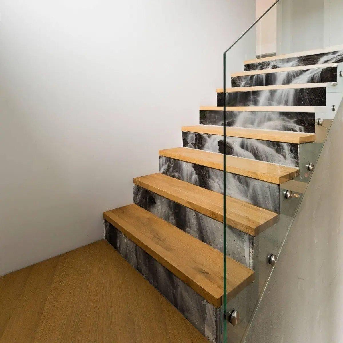 Trendy abstract vinyl sticker decals on wooden stairs, showcasing a waterfall design for home decor.